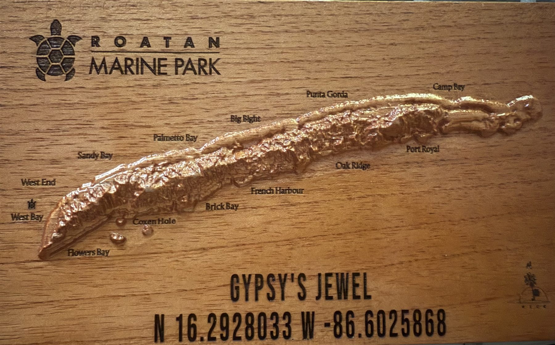 The Roatan Marine Park carving of the island in relief, marked Gypsy's Jewel with its coordinates